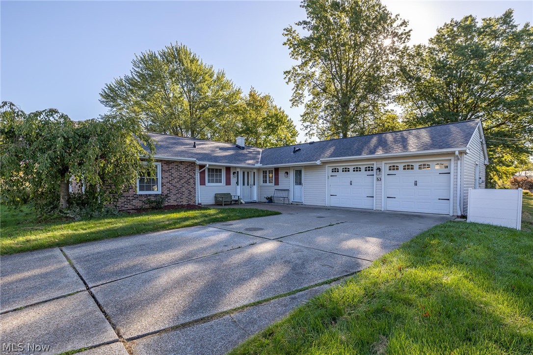 Fantastic one floor living! Three bedrooms and two full baths with an amazing open concept. The beautiful fireplaces in the kitchen and great room make this a wonderful place to entertain. There are newer doors and windows, updated flooring, paint, new roof (2021) and newer nature stone garage flooring. Wall to wall windows overlook the stamped concrete patio. The large and updated eat in kitchen features quartz counter tops. High end appliances, including washer and dryer will stay with the home. Optional neighborhood membership includes access to the beach on the lake, and social events hosted throughout the year. Aurora Schools, located between Cleveland and Akron, Come see it today!