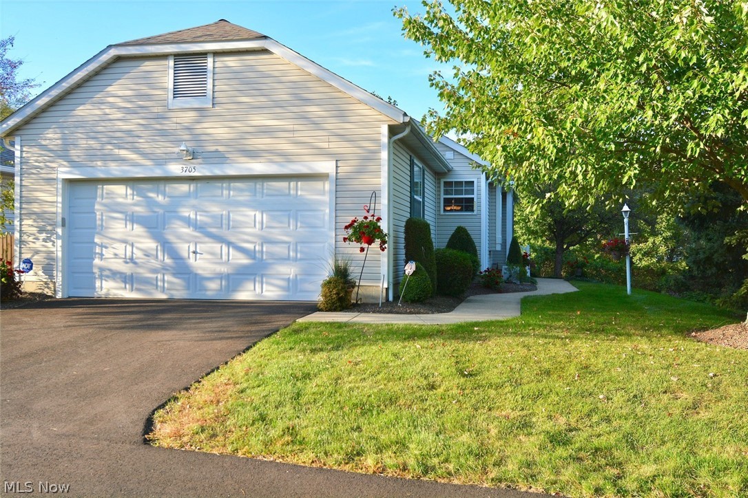 This fabulous condo has it all! It is beautifully maintained and updated throughout! There are FOUR bedrooms & 2 1/2 baths! The eat-in kitchen has beautiful granite counters & back-splash, a stainless steel range and refrigerator, wood flooring, a pantry, and a window seat! The great room has a vaulted ceiling (w/ceiling fan), a gas fireplace, and sliding glass doors leading to a beautiful four-season sunroom, AND a screened porch just off the sunroom w/fabulous views of the backyard! The master bedroom has a vaulted ceiling (w/ceiling fan) that easily accommodates king sized furniture, and there is a door leading to the screened porch from the master bedroom! The master bath has a jetted tub as well as a new step-in shower. The 2nd bedroom (w/ceiling fan) is just steps from the main bathroom, making it a perfect guest bdrm. The 1st fl laundry, just off the garage, has cabinets and a large closet for storage, as well as a sink w/a drain in case of overflow. A huge family room, 2 more b
