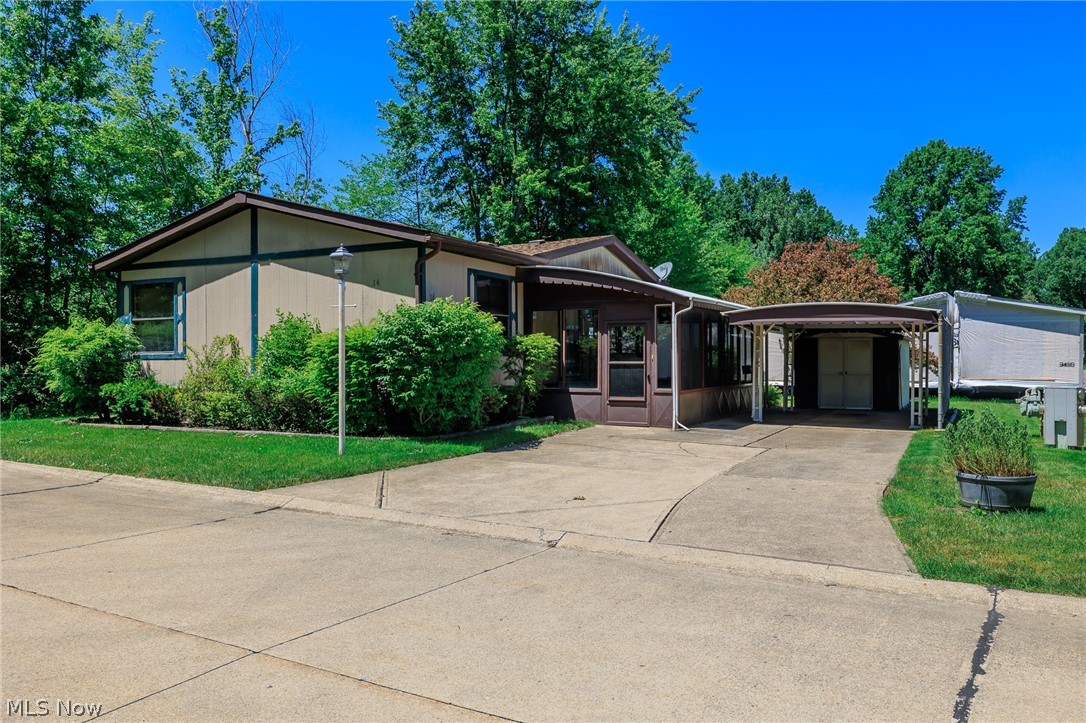 COLUMBIA PARK IS A 55 AND OLDER CONCEPT OF LIVING and is Ohio's Premiere Adult Land Lease Community! Amenities include: Gatehouse managed entrance! On site Shopping Plaza! On site Management! Walking Path/Dog Walking Path! Shuffleboard! Bocce Ball! Library! Crafts, and Social Hall!  WOULD YOU LIKE TO LIVE ON ONE OF THE GREATEST LOTS IN COLUMBIA PARK.....LOOK NO FURTHER.  This 1988 Schult Manufactured Home measures 48 x 24 (1152 sqft.) and offers  three (3) bedrooms, (2) two full baths, formal living and dining rooms, its own designated laundry room and a nice little kitchen with a counter for your breakfast stools.  There is also a three season sunroom measuring 23 x 10 for those relaxing nights in total privacy....  This home is at the end of the street, surrounded by woods with its own little creek.  The roof was replaced 9 years ago and the A/C Condenser is 6 years old.  This home is being sold As Is....Priced To Sell..  Just bring your tool belt, paint brush and decorating ideas an