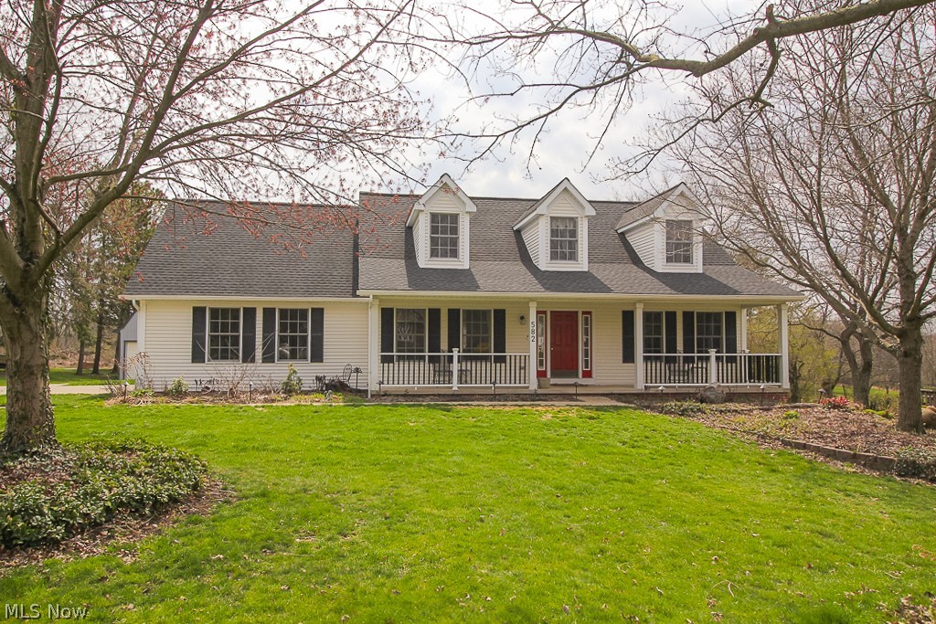 If you are looking for a unique property with a huge pole barn and beautiful yard, this is the home for you! Custom built, cape cod style home with many updates and amenities. Beautiful open feel kitchen with granite counters and breakfast bar that flows into the great room with wood burning fireplace. Formal dining room and office with hardwood flooring. First floor master suite with soaking tub, separate shower and walk-in closet, plus a first floor laundry. The second level features two large bedrooms and a full bathroom. Finished basement has a spacious rec room, custom bar and gaming area. The backyard features a spacious deck with a hot tub that steps down to a tiered paver patio with built in grill and firepit. 24x36 two story pole barn with electric and heat. Perfect for someone who works on cars or needs the storage space! A wonderful opportunity! Situated on a large lot (almost an acre), small green house, above ground pool Plus more! Newer roof, gutters with leaf guard on house and barn. Relax on the covered front porch! Better hurry on this one!!
