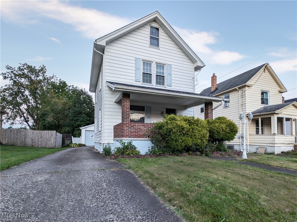 Welcome home! This nicely updated 2BR, 1 Bath home is absolutely ready to enjoy! Stunning like-new original trim everywhere with built in cabinetry too! Amazing French doors lead to the formal dining room as well. All that beautiful woodwork is surrounded by updates throughout. Original hardwood flooring with newer neutral plush wall to wall carpeting throughout. Newer windows fitted gracefully into the original casing and windowsills. Updates galore: newer roof, updated kitchen with stainless appliances, newer lighting, newer high efficiency HVAC (central air) and water heater. Fresh neutral paint too. Walk outside to two cozy covered porches to relax and enjoy your time off. Plenty of room for your stuff in the spacious detached garage and attached sunroom for gatherings.
