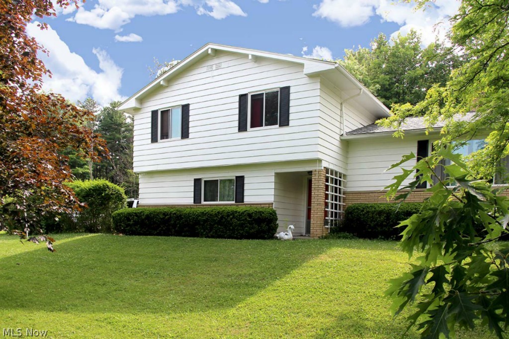 Outstanding location!  Idyllic 4 Bedroom 2 1/2 Bathrooms setting on  1.37 acres in Bath township.  Beautiful views from the top of the hill all year long.  New Carpet 2015, New paint 2015 all living areas, Newly refinished hardwood floors 2015,  New floors in all three baths 2015. New roof 2011, exterior painted 2011,  New windows 2012 .  Septic  serviced and pumped 2013. Enjoy the covered patio off the family room with wild life abounding.  Large living room with expansive window looking over the Cuyahoga River Valley.  Eat in Kitchen opens to formal dinning area.  The upper level features 4 Spacious bedrooms including Master suite with its own bathroom.  Minutes from Hale Farm and Cuyahoga Valley National Park.  Kitchens and Baths could use some updating.  This is your opportunity to make this house your own at a reasonable price. Call today for your a private viewing.