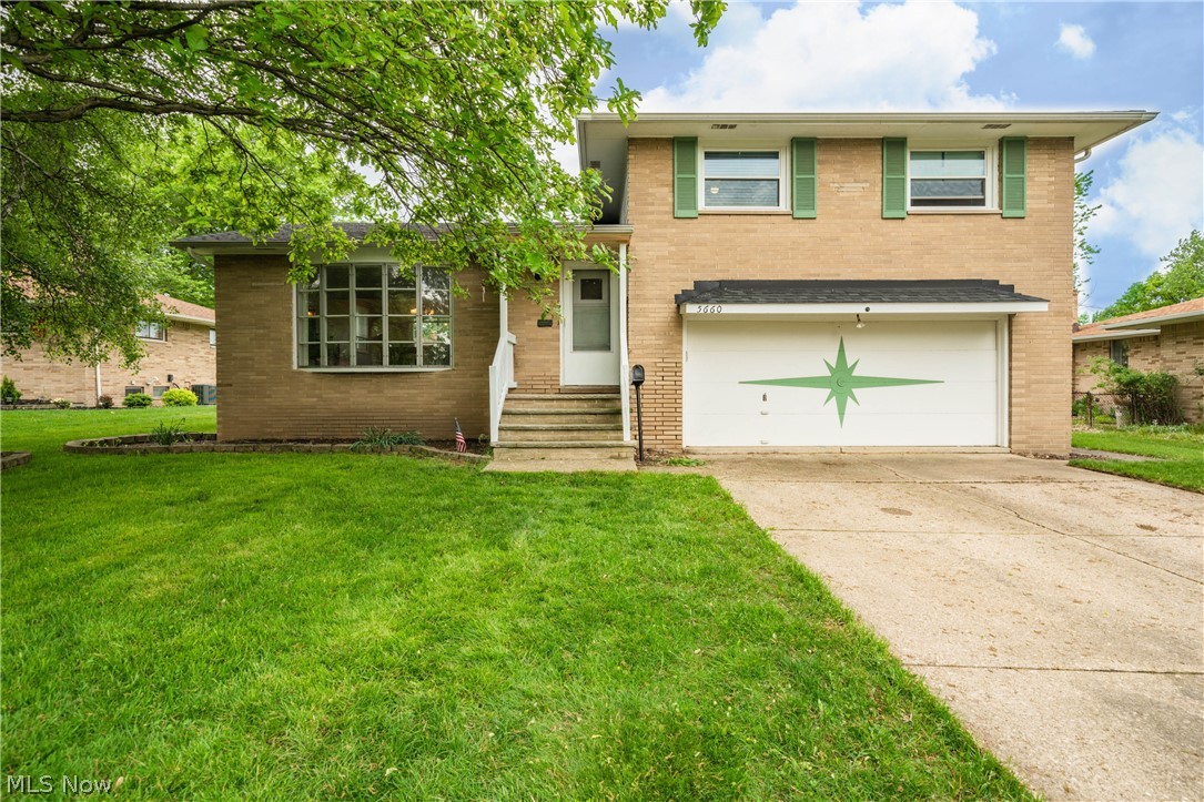 Don't miss this charming 3 bed, 1.5 bath split-level home with spacious backyard and four complete levels of living in Seven Hills! The first level features a warm and inviting living room with large bay window, dining room and eat-in kitchen space with updated counter top and back splash and white-painted cabinetry. Upstairs you will find the full bath and three generous sized bedrooms. There are hardwood floors underneath the carpeting of all three bedrooms and the living room! The lower level, which can be closed-off by pocket door, will make a great second living space or play area and has direct access to both the 2-car garage and to the stamped concrete patio and backayrd space. But wait, there's more! The basement area features another living space, laundry area, an abundance of storage and another room currently being used as an office! A one year home warranty is included for your own peace of mind! You truly have to see this property to know all it has to offer.  Contact us t