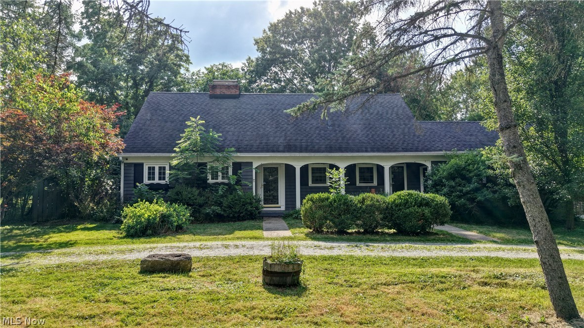 Charming Cape Cod within close distance to historic downtown Hudson! Situated on a deep, private, tree-lined lot, this well-maintained home offers a flexible floor plan with a first-floor bedroom and full bath—ideal for convenient main-level living. The inviting living room features a cozy woodburning fireplace and hardwood flooring, flowing into a formal dining area and updated eat-in kitchen with ample cabinetry, granite, cooktop and workspace. A bright sunroom with bluestone flooring provides additional living space and scenic backyard views. Upstairs, you’ll find generously sized bedrooms, including a primary suite with en-suite bath includes tile walk-in shower, and double sinks. Upstairs laundry. The finished walkout basement adds extra living/entertaining space with a second fireplace. Exterior highlights include a circular driveway, new detached two car garage doors, and mature landscaping. Move-in ready with numerous updates including double sump pump back up system, new kitchen vent fan. Prime location close to shops, dining, parks, and schools.