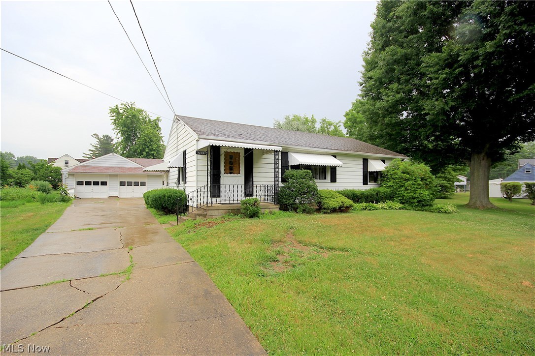 Attention car buffs! 6 stall garage tucked away on five city parcels on the edge of Massillon. Two of the parcels can be combined and are buildable. Recently updated this cozy home is located on a beautiful park like setting and is perfect for relaxing or entertaining. The basement has been finished providing an additional living space with a closet and a half bath. This area would be great for a teen retreat or guest suite.  Call today for your private showing