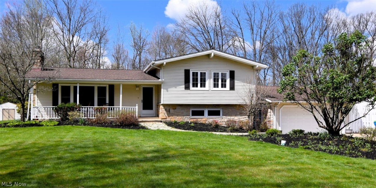 Outstanding updated split level home on quiet cut-de-sac street. Award winning Chagrin Falls schools! Warm, charming but UPDATED in today's decor. As you enter the living room you are greeted by beautiful flooring , wood soaring ceilings, a brick fireplace wall and a wall of floor to ceiling windows. The living room opens a formal dining room which always is wide open to the large family room with a second wonderful fireplace, wood beamed ceiling  and sliding glass doors out to the deck, fantastic screened in- gazebo, great place to spend time in, a changing cabana and the fabulous in ground pool surrounded by a charming brick deck. Off the main living space is the newly renovated kitchen that was just completed March of 20206, with stunning cabinetry, subway backsplash, quartz countertops,  stainless steel appliances, cooktop, (2024)oven dishwasher ( 2026) and view of the backyard! .Off the kitchen is another family room! Completing the first floor is a huge recently updated laundry room   and an amazing  updated full bath, perfect to accommodate your guest at the pool! Upstairs has the primary suite with a private bathroom, wood beamed ceilings and a private balcony overlooking to yard! There are two other bedrooms and another full updated bath upstairs. The recently  finished lower level makes a great playroom, gym extra room or whatever your needs may be! For the car lovers.... there is a  FOUR CAR ( tandem) attached heated garage with epoxy floors, workspace is a space, great could be for many hobbies! Sidewalks can take you to the village center to enjoy the Chagrin Falls lifestyle! Special street in a special area!!