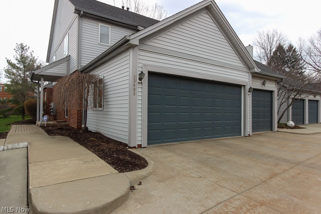 Move-in ready & updated, end unit townhome in Larchmere Square! New furnace & AC 2016. Welcoming foyer w/beautiful leaded glass window, large closet & tile flooring. Updated 1st floor half bath! Eat-in kitchen is open to the foyer & the living room, has a glass tile back-splash & comes fully equipped w/appliances. Open concept dining & living room with hardwood floors is full of natural light & has large sliding door to the patio. The 2nd floor offers 2 bedrooms & a full bath. The Master bedroom is large & has a newer modern ceiling fan, double closets w/organizers, cordless Levolor blinds & direct access to the gorgeous full bath: new vanity w/granite countertops, double sinks, new light fixtures. The 2nd bedroom is also a nice size with double closets. The finished basement has new carpet & fresh paint, is wired for speakers & makes a great rec room!  Basement also offers 2nd full bath & the laundry room: 2014 washer & dryer stay! Fenced-in/private patio! Attached 2 car garage! Perfe