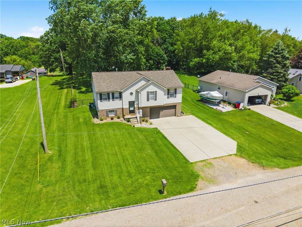 Welcome to 6055 Apple, this spacious bi-level home in Louisville offering 4 bedrooms and 2.5 baths on nearly half an acre! Enjoy the convenience of main floor laundry and a functional layout designed for everyday living. The bright main level features a comfortable living space highlighted by an electric fireplace, perfect for cozy evenings. The lower level provides a large finished area ideal for a rec room, home office, or additional living space. Step outside to a fully fenced backyard with plenty of room to relax, entertain, or enjoy outdoor activities. With generous space inside and out, this home offers the perfect blend of comfort and versatility!