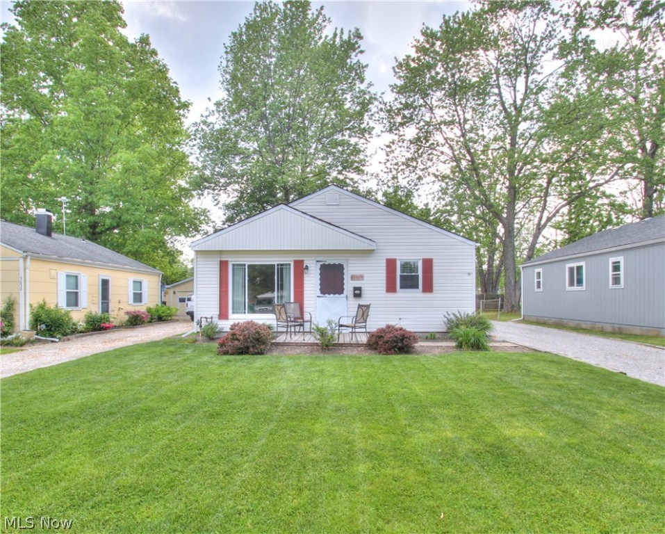 Nothing to do but MOVE IN! Most all big ticket items have been installed or replaced! Newer windows, newer shingles, 10' x 10' porch, upgraded fuse panel to breaker panel, central air, hot water tank, concrete pad in front of HUGE 2 1/2 gar garage, new garage roof (2019), new bathroom flooring (2020) and installed storm sewer system. Updated kitchen with newer countertops and newer stainless steel appliances and washer. Beautiful lot on a quiet street. Walking distance to Lake Erie and Headlands Beach! Sellers are offering a 1 year home warranty! This one won't last! Come See!!!