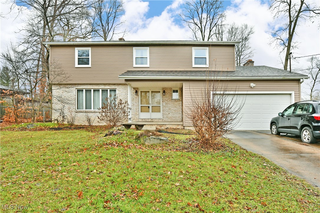 Offering up great looks and tons of potential, this four-bedroom Champion home is ready to bring your homeowner dreams into a reality! Delighting with a great location within a high demand neighborhood, this residence brings both privacy and convenience. Keen eyes will be immediately drawn to the fenced in backyard where multiple patio spaces join both an above ground pool, large storage shed and a unique water feature. Leading you inside, a curving sidewalk ends at a covered entryway with double doors. Past the foyer a carpeted staircase rises to the second-floor bedrooms as a gracious, carpeted living room enjoys plenty of natural light from its massive split pane, picture window. Formal dining awaits just around the corner with instant kitchen access. The kitchen itself is home to stainless steel appliances and contrasting cabinetry while hardwood-style flooring runs underfoot. Casual dining space offsets both the basement entrance and a colorful half bath. Completing the floor, laundry services transcend a charming rear family room showcases a brick lined fireplace and sliding glass doors opening to the backyard. Upstairs, an oversized master bedroom suite quickly captivates to include a walk-in closet, dressing area and handsome, full private bath. Down the hall, three additional bedrooms are accompanied by a deep-set full bath. Storage and potential rec space can be found at the basement level.