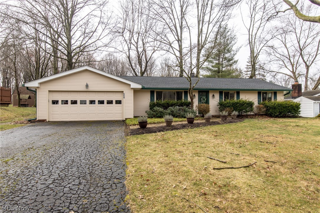 Rarely on the market  - a home on Orchard Grove Avenue!  This RANCH offers an open floor plan & a fabulous 3-season room overlooking a semi-private backyard! You will love this home from the minute you enter the front door - the large a living room is great space for home entertainment, the family room has a gas fireplace and is open to both the dining room and the kitchen; there are 3 bedrooms with two updated bathrooms!  (One bedroom has direct access to one of the full bathrooms!) Laundry is located on main floor!  Situated on almost an acre!  Well maintained so all you have to do is move right in - Newer roof, siding, windows: Furnace about 7 years old and has been retro-fitted in case you want to add central air conditioning.  1 year HSA Home Warranty is offered for peace of mind.  Great location.  Village of Sagamore Hills.  A picture is worth a 1000 words - take a look and schedule a private showing before this home is gone.