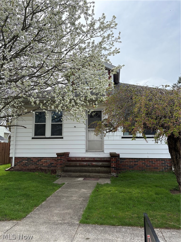 Beautiful brick home with one floor living.  Attic space upstairs unfinished.  Two bedrooms with a possible third that is currently an office space.  Large dining room and living room.  Hardwood floors throughout.  Mud room off of the kitchen.  Full basement with canning room and work bench area.  Back yard has a cement pad off of back door perfect for grilling. Major updates include central air/furnace and windows. Roof about 8-10yrs new. Come check this one out as all the big updates are done!