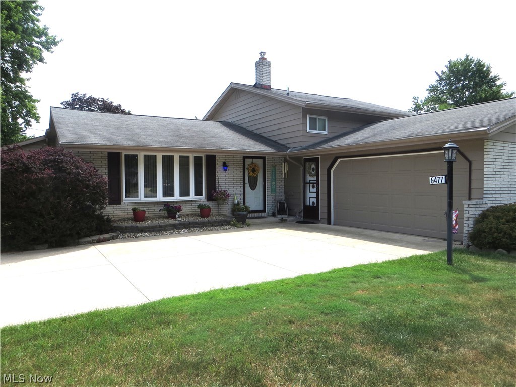 Walk through the front door, pause, take it all in! This pristine 3 bedroom, 2 full bath home is the definition of “Pride of Ownership.”  Long-time owners painstakingly combined features which provide the “comforts of home” while incorporating both indoor and outdoor entertainment space. The main-floor living space provides a much sought-after open-floor plan.  Anchored by the kitchen and dining room - the heart of the home - are two living areas. The formal living room is accented with a bay window, vaulted ceilings, and carpeting. The family room, added to this home in 2004, is a real showstopper! Nestled at the back of the home this room is bright & airy and graced with privacy windows where only the sunlight can see in! Vaulted ceilings soar.  A gas fireplace affixed within a stunning stone mantel provides warmth when the “brrrr” months arrive. Sliding doors take you to the backyard retreat. The kitchen features a skylight, plenty of cabinetry, and stainless-steel appliances-stove and refrigerator purchased in 2025. An archway separates the kitchen from the dining area. Both rooms have LVT wood-flooring.  All first-floor carpeting was replaced in 2023. Upstairs, you will find three spacious bedrooms. The main bath, remodeled appx 2-years ago, features a jacuzzi bathtub. The lower level is where fun happens! Nuzzle up to the hand-crafted bar with built-in display shelving, lights, and hanging stemware rack. Barstools convey. Full lower-level bath with marble countertops and Bath Fitter insert remodeled appx 3-years ago. Laundry connects to the garage. Washer & dryer convey. Furnace & A/C 2025. Outside, take shade under the pergola. Read a book while lounging on the Trex deck.  Garden.  Light the firepit when it gets cool. Do this all while in the embrace of a privacy fence. Plenty of room in the side-yard for cornhole games, volleyball, or whatever suites your interest. Whole house interior (except bedrooms) painted 2023. Whole house exterior painted 2023.
