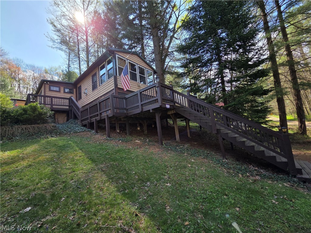 If you've been patiently waiting for a superb lake cottage to call your own, your day has come at beautiful Leesville Lake! The living room plays host to a majestic stone-flanked fireplace in true lodge style. Kitchen features stainless steel appliances, a breakfast bar, and Corian counters. The adjacent dining area is spacious and includes a wood-burning stove and lots of natural light. Tongue-in-groove ceilings and floors throughout make for a truly authentic cabin vibe. Newer stainless front laundry appliances will be conveyed with the home. Take in the picturesque views of nature from the wraparound deck, or the frontal breezeway. Additional storage room under the deck. Metal roof on both the home as well as the 20'x20' insulated storage/workshop building, which was built in 2012. There's also a second "she-shed," perhaps for gardening supplies, yard toys, or the like. Whether full- or part time, your lake life opportunity is beckoning now! Ask your favorite agent to see this property today and don’t forget to ask about the pontoon boat that could go with the property!