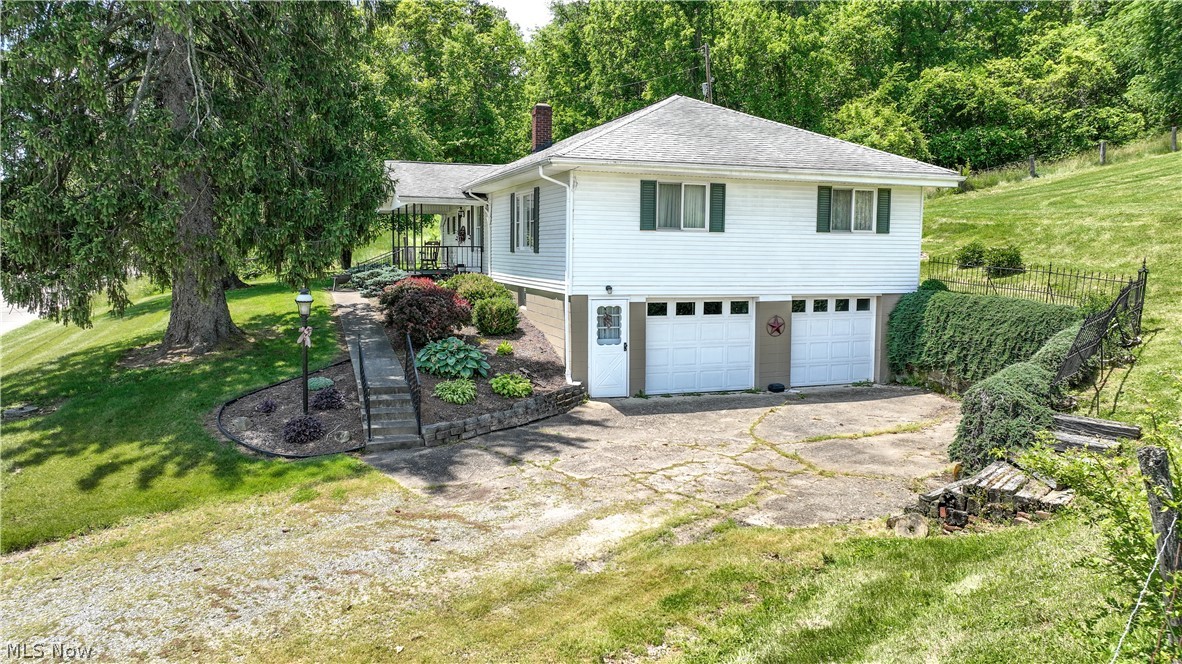 If you've been dreaming of a little more space out of town, this ranch home just outside of Quaker City could be the perfect fit. Nestled on a half acre lot in a country setting, this property offers the best of out of town living while still being conveniently located near local amenities. The main floor features three bedrooms, a full bathroom, a comfortable living room, and a dining room that's ready for family dinners and holiday gatherings. The kitchen is highlighted by beautiful oak cabinets and plenty of storage, creating a warm and welcoming space for everyday living. Downstairs, the basement provides additional functional space, including a full bathroom, laundry area, and a kitchenette that's ideal for canning, cooking, or extra food preparation. While the basement is unfinished, it offers plenty of potential for storage, hobbies, a workshop, or future customization to suit your needs.
Outside, you'll appreciate the half acre yard with room to garden, play, or simply enjoy the peaceful surroundings. The attached two car garage provides convenient parking and additional storage space. Mineral rights will not convey.