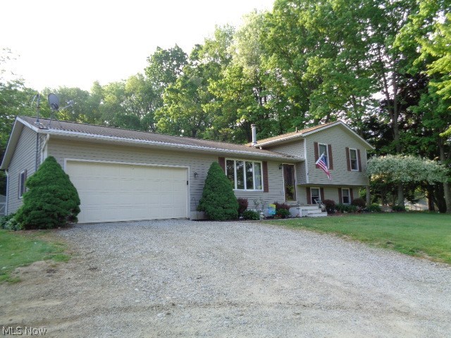 Welcome home to 2115 Canton Road, Akron, OH  44312!  This lovely home is newer but has been well maintained by the original owners!  You'll enjoy peaceful setting with gorgeous views.  Home features x-large eat-in kitchen, 3 large bedrooms and rec room along with an office in the lower level.  This 4 level split also offers additional storage in the 4th level basement!