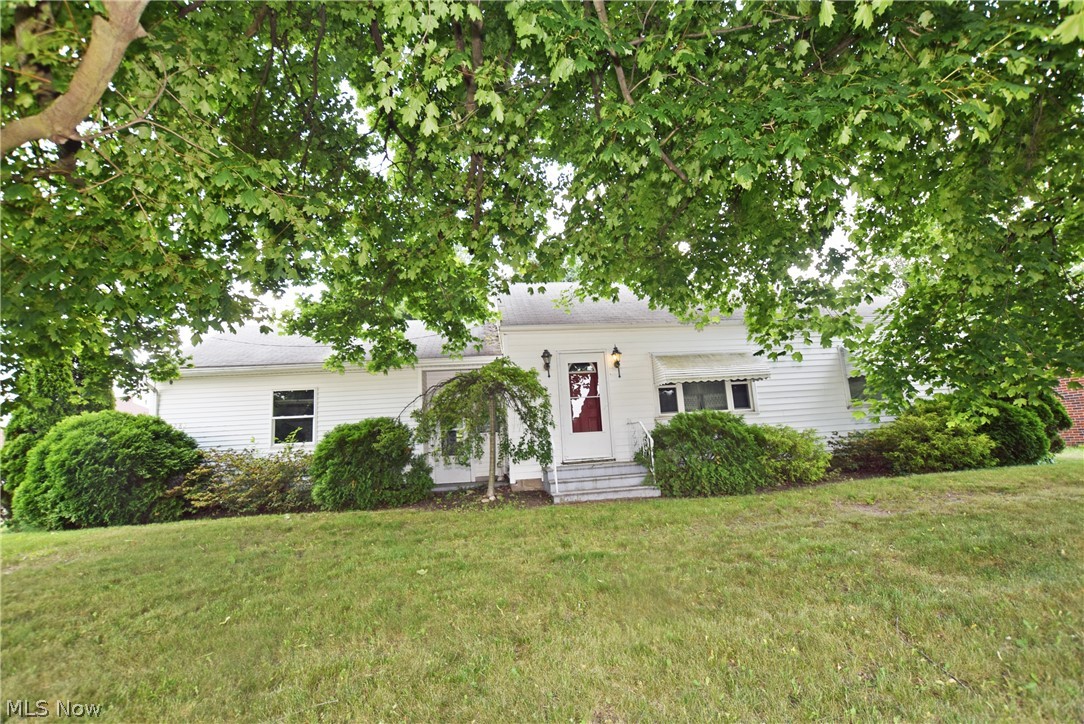 Surprisingly large Kitchen and Living room. Rear entry garage off of side street still leaves plenty of back yard space. All appliances can stay including the stair lift or seller can have removed if you wish. Kitchen renovation about 15+ years ago.  Windows are vinyl replacements. Seller is providing an America's Preferred Home Warranty for your peace of mind.