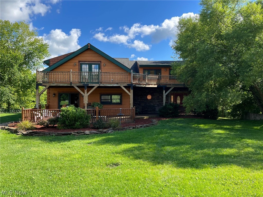 GETAWAY to this One-of-a-kind Rustic Retreat situated on over 3 Peaceful Acres! This unique Stone & Logged Home includes 3 finished levels w/open concept living, vaulted/beamed wood ceilings & spiral staircase. Covered front porch welcomes you into the entryway w/hardwood floors through to the Living Room & large Eat-in Kitchen w/center island breakfast bar & all appliances stay. 1st flr Office can also be used as a Bedroom. 2nd floor includes 2 loft areas w/skylights & vaulted Master Bedroom Suite with fireplace, french doors to balcony & Master Bath with jetted tub and separate shower. Finished lower level includes Stone Hearth Room w/2-story wood burning fireplace w/water feature that is truly the center of this home and can be seen from each level. Lower level also includes Rec/Family Room w/wet bar, full bath w/ceramic shower/sauna & walk-out double french doors to patio with fireplace. Exterior logs have been freshly stained. Owner used outdoor wood burning furnace as primary hea