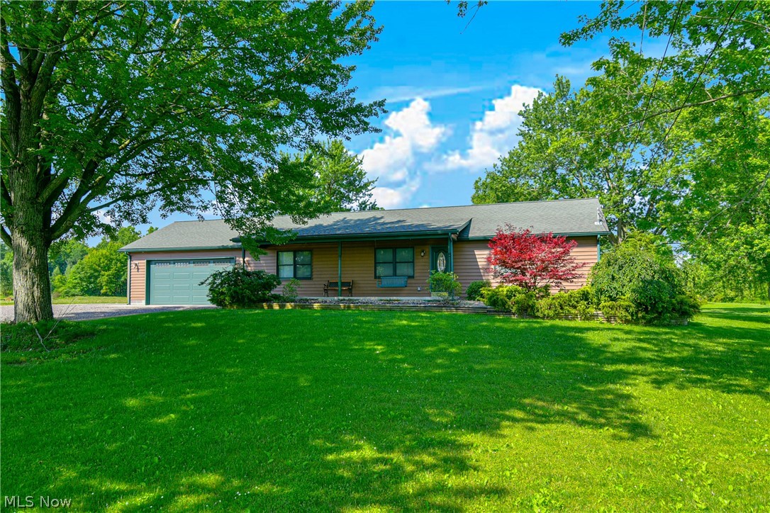 Amazing property with so many magnificent features inside and out. Fantastic lot with a gorgeous stocked lake, huge outbuilding and scenic views, sunrises and sunsets. The inside features do not disappoint! Custom woodwork & handmade cabinetry in the kitchen. Hardwood flooring in the great room, kitchen and dining room. Pulling into the drive & walking onto the front porch you even have lake views from the start! Walking into the front door you will see the excellent open floor plan. Dining room opens to the kitchen. Beautiful granite countertops, large island, wet bar. Appliances to stay! The great room has French doors on each side, leading to a deck and patio. Gorgeous floor to ceiling fireplace, fantastic natural lighting, skylights & built in desk. The owner suite has its own private French doors walking out to the deck. Large closet & door into the shared full bath. Two additional bedrooms, great closet space! 1st floor laundry with washer dryer & 2nd full guest bath. The basemen