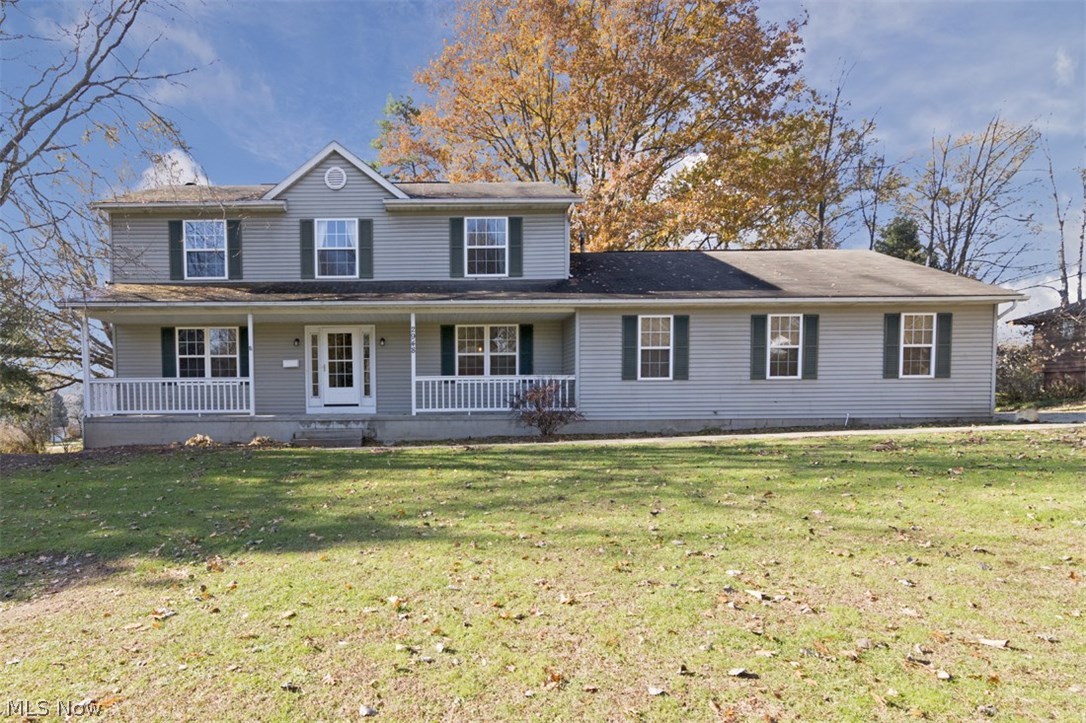 Rare opportunity for a beautifully updated colonial on a corner lot in Silver Lake! With over 2,000 square feet of warm and inviting living space and a fantastic back deck, this lovely home is just waiting for a new owner! The front porch opens to the foyer, with a spacious living room to the left and a nicely updated dining room on the right. The kitchen features an abundance of lovely oak cabinetry, a breakfast bar and an eat-in area with sliding glass doors that open to the back deck, perfect for cookouts. Off of the kitchen, there is a family room with a brick hearth fireplace, a convenient laundry room, and a bedroom that could also be used as an office. Upstairs, the master bedroom provides a huge walk-in closet with built-ins and a nicely updated en-suite bathroom. Three additional bedrooms and a common bathroom complete the second floor. The lower level is partially finished with a spacious recreation room and an additional full bathroom. Recent improvements include a newer wat