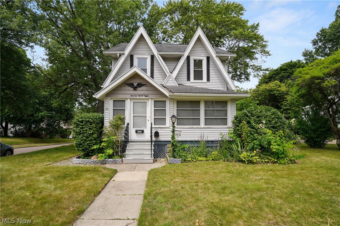 Lovingly cared for Colonial on corner lot featuring an enclosed front porch w/ceiling fan/light & wall a/c unit. Enter into the large carpeted living room w/brick fireplace w/oak mantel/bookcases, natural woodwork, ceiling fan & curved doorway into formal dining room. Dining room has high window seat w/3 rows of drawers, chair rail & natural woodwork. Applianced kitchen has lots of cupboards & counters, ceiling fan & breakfast room w/skylight & even more cupboards/drawers w/room for table & chairs. There's also a first floor full bathroom w/skylight, jetted tub w/grab bars & an oak vanity. On the second floor are 3 nice sized carpeted bedrooms w/ceiling fans & second full bathroom w/step-in shower w/two seats, oak vanity plus two "make-up vanities". In the hallway is a "secret closet/ladder" to the "secret room" which is 3rd floor bedroom, playroom, office or whatever you need it to be w/built-in desk/table, low cabinets along the wall, and closet. Fun hideaway!! OR seller will remove ladder, return it to an actual closet and re-install pull-down stairs in the hall ceiling (boring!). Lower level includes office or small rec room, laundry room w/utility sink, closet & cupboards, & large workshop with tons of cupboards, counters & misc bins/drawers, plus additional hidden storage behind the wall. The utility/furnace room has additional worktable/shelf. The back/side yard is very private due to fencing, bushes & trees & includes a brick path to brick patio, picnic table, covered gazebo type swing/seating area, benches & tons of flowers/perennials. Theres a heated 2-car garage w/bump-out for extra room. Lots of charm in this house with the natural wood throughout, fireplace and bookcases, rounded doorways, glass-knob doors, and spacious rooms. Updates include A/C less than 10 years, furnace/humidifier 2015, H2O 2010, electric 2 yrs (150 & 100 amp), glass block, supply line from street replaced, front door 1 yr, gutter guards. Make your appt TODAY to see your new HOME!