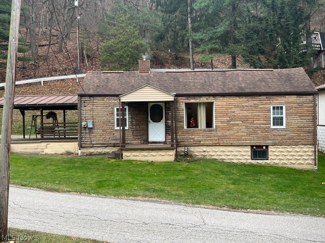 What you have been looking for! This cozy ranch home is in move-in condition. The kitchen is newer, and this house is ready for you! There is a very nice basement with a shower. The furnace is about 10 years old, and the roof is about 15 years old. Per the seller, there is a small trickle of water from a natural spring that runs against the basement wall. It has been that way for 65 years! There is also a sump pump in the basement. Huge concrete-covered patio with a newer metal roof. 20x15 is perfect for outdoor entertaining. The swing stays. There is a nice one-car garage with a manual door and opener. Starting out? Scaling down? Perfect! Public natural spring next door.
