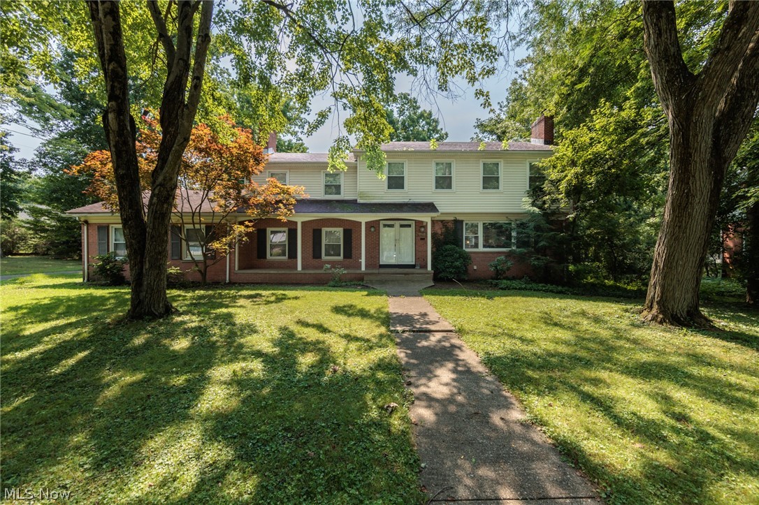 A truly remarkable West Akron colonial with 3 bedrooms and 3 full bathrooms is a stone's throw from Stan Hywet Hall and Gardens.  This home features almost 2700 square feet, and sits on .371 acres of a desirable neighborhood.  The large living room features a wood burning fireplace and natural hardwood floors that flow through the formal dining room.  A family room also has a fireplace, with natural wood floors and ample natural light.  The retro eat-kitchen is very spacious, with ceramic floors.  A full bath and laundry round out the first floor.  The bedrooms are HUGE, with natural wood floors in most of the upstairs.  There is also an office, whole house fan, and 2 full baths upstairs.  This home features an attached 2 car garage, full basement, front porch, patio, fenced yard, and so much more.