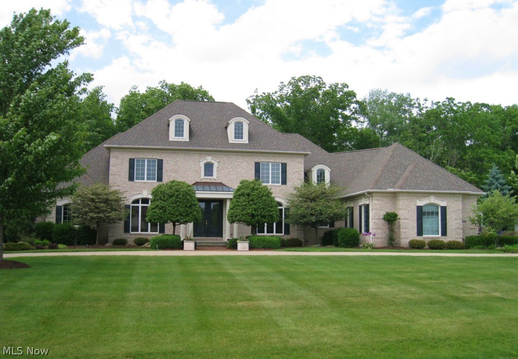 Absolutely fabulous 6 bedroom 7 bath Brick Traditional on a prime lot in Firestone Trace!  The two story foyer has a dramatic curved staircase with an open  loft above.  Beautiful symmetry and architectural details throughout.  The big bright kitchen opens to a cathedral hearth room surrounded by windows, a morning room in the center and large great room.  The 9' ceilings on the first and second level, oversized windows and open floor plan create the spacious feeling buyers prefer.  The first floor master suite includes a cathedral bedroom, separate sitting area, private screened porch and large master bath.  French doors from the foyer lead to a cozy library.  The first floor also includes a rear office, back hall with beautiful built in storage and first floor laundry.  The second floor has 4 additional bedrooms and a loft. The finished lower level includes a huge rec room, bedroom and full bath. 2 fireplaces, 3 car side entry garage, heavily wooded premium lot and so much more!