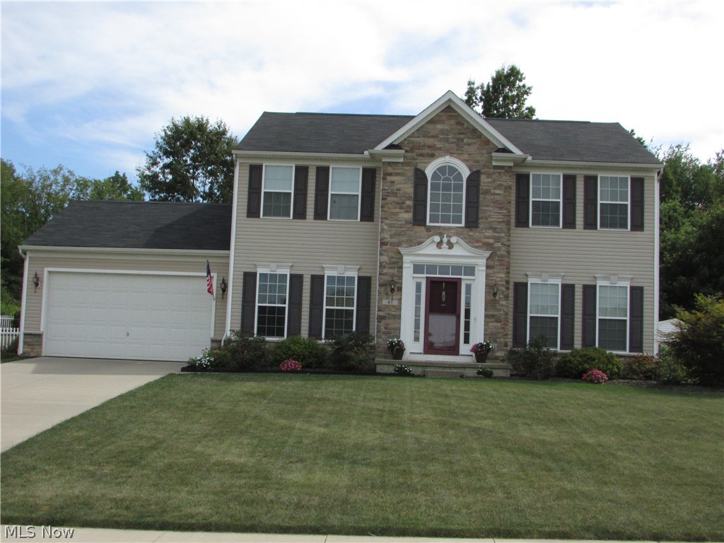 WOW!  A stunning 4 bedroom, 2 1/2 bath Colonial in Fox Ridge of Tallmadge.  One of the many highlights of this home is the 9' ceilings on the first floor.  The open floor plan allows for the kitchen, large family room, and morning room to feel together.  The family room has a fireplace, and opens to the formal living room.  The gourmet kitchen has an island, wood floors, and has a 20x10 morning room, as well as a formal dining room.   The natural wood floors run throughout the kitchen, morning room, and 2 story foyer.  A master suite has ample closet space and vaulted ceilings.  The large lot has a very large area of fenced space, a deck, and a shed.  There is a 2 car garage, full basement (that is plumbed for a full bath and wet bar), first floor laundry, and so much more.