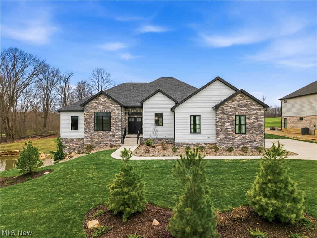 Desirable Ranch on Kensington Golf Course – Canfield, Ohio.....
Experience elegant golf course living in this stunning ranch-style home overlooking the scenic fairways of Kensington Golf Course. Designed with comfort and sophistication in mind, this property combines open, airy living with top-quality finishes throughout.

Step inside to an impressive open floor plan with high ceilings and abundant natural light. The kitchen is a true centerpiece — featuring white cabinetry, granite countertops, a custom backsplash, and a 10-foot island with seating, perfect for entertaining. The great room offers a custom-built fireplace framed by black Pella windows that showcase beautiful golf course and pond views.

The owner suite is a private retreat with tray ceilings, an accessible closet, and a spa-inspired bathroom featuring a porcelain tile shower, marble wall, and a soaking tub. Two additional bedrooms and one and a half well-appointed baths complete the main level.

Enjoy four-season living in the sunroom or step out onto the covered upper patio with outdoor ceiling fans — ideal for relaxing summer evenings. The walk-out basement opens to a stamped concrete patio and professionally landscaped yard enhanced by landscape lighting.

Additional features include a spacious laundry room, three-car garage, and recessed lighting throughout. With unparalleled views and modern design touches at every turn, this home captures the best of Canfield’s luxury living.

other amenities include- (all appliances) range, dishwasher, refrigerator, microwave, washer and dryer.
- 1 year home warranty 
- plumbing in basement for future bathroom
- tankless hot water system
- security system with smoke and carbon detectors
- window coverings