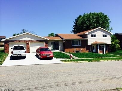 This Multi-level brick home has All the following updates: Kitchen,(FLoor, appliances, countertops) Bathrooms (tub, floors,vanities),Windows,Gas FA Furnace 2011, redone recroom (floor is ready to put whatever you like),freshly painted,  new sliding doors,new concrete patio and driveway.