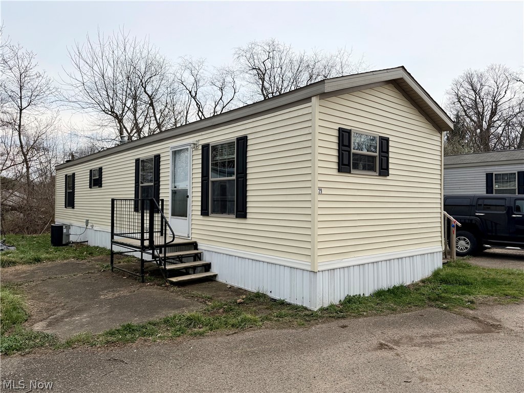Check out this modern one-story mobile home in Massillon! Built in 2021, the open floor plan includes a large living room, a spacious eat-in kitchen that’s fully applianced with tons of cabinet space, a sizable master bedroom, and a spare bedroom or office. The roomy full bathroom features a large soaking tub/shower and stackable laundry hookups for added convenience. Enjoy affordable, low-maintenance living in this quiet neighborhood, located just minutes from Downtown Massillon. The home can also be relocated if desired. Call today to schedule your private showing!