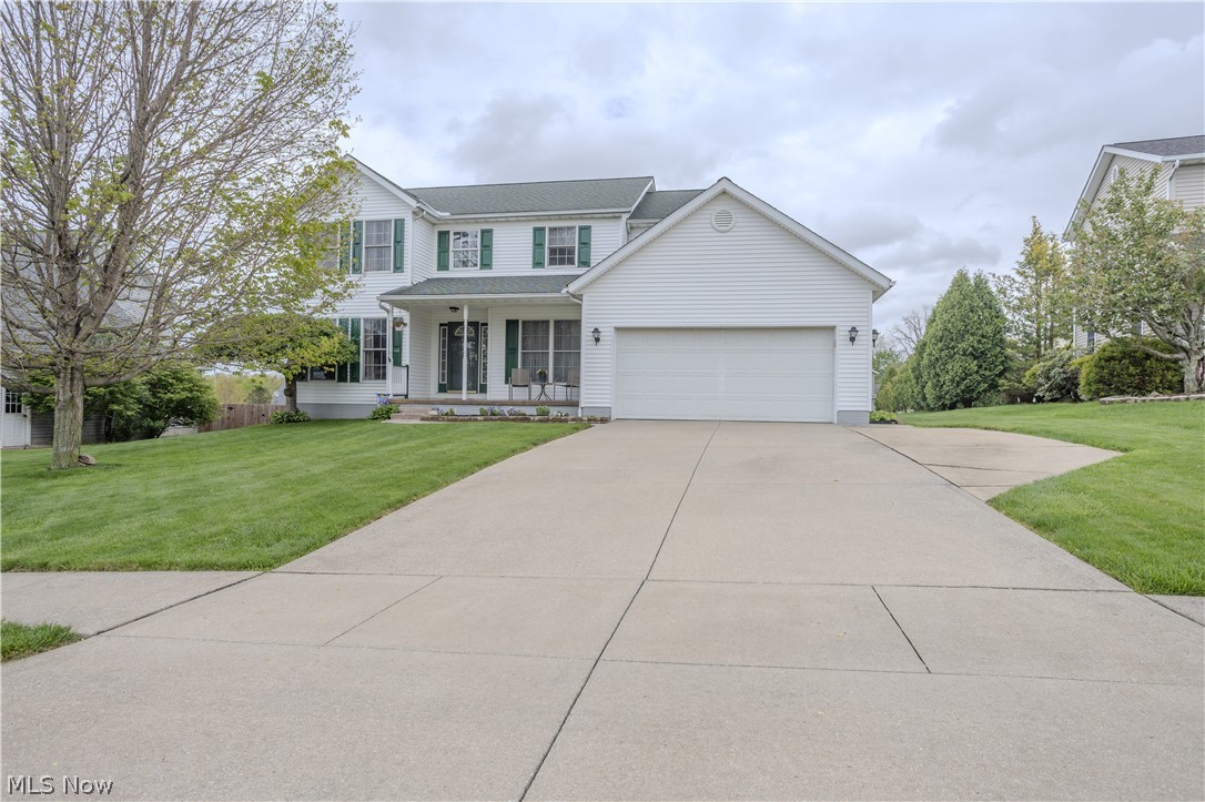 Welcome to this meticulously maintained colonial located in the highly desirable Annevar Estates in Ravenna! This spacious 4-bedroom, 2.5-bath home offers the perfect blend of comfort, functionality, and charm with 2154 square feet.

From the moment you walk in, you're greeted by a stunning oak staircase and a formal dining room that sets the tone for the rest of the home. The main level features a generously sized family room, along with a versatile first-floor bedroom that can easily be used as a home office, playroom, or guest space.

The kitchen is both warm and inviting, showcasing beautiful oak cabinetry, stainless steel appliances, and convenient access to the first-floor laundry room. The kitchen has a generous amount of cabinets and a pantry as well.

Upstairs, you’ll find three additional bedrooms, a 2nd full bathroom, and a spacious primary suite complete with a walk-in closet and private full bath with double sinks and a jetted tub.

Step outside and fall in love with the expansive outdoor entertaining space. The oversized tiered deck offers multiple areas for gathering, relaxing, and hosting, and leads down to a concrete patio—perfect for summer nights. The large backyard provides plenty of room to enjoy, along with a storage shed for added convenience.

Updates include roof 2019, hot water tank 2018, furnace original, A/C 2018, windows original, LVT upstairs 2023, stove 2022, fridge 2022, dishwasher 2022

This home truly checks all the boxes—don’t miss your opportunity to make it yours. Homes like this don’t last long!