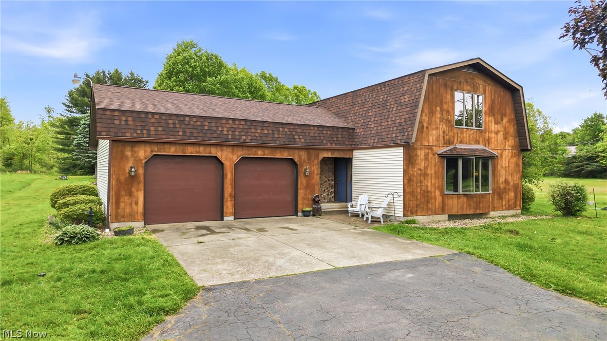 Welcome to your ultimate country retreat at 6667 Chestnut Ridge Rd! Set on 12 sprawling acres of wooded beauty, this unique Hubbard property is an absolute dream for hunters, outdoor enthusiasts, and hobbyists alike. Offering incredible on-site hunting opportunities and unparalleled privacy, this land is a rare find. The property features a spacious 24x38 barn/outbuilding complete with a concrete floor, water, and electricity. Offering endless possibilities for livestock, a workshop, heavy equipment storage, or the ultimate hunting cabin setup. At the heart of the estate is a charming 3-bedroom, 1.5-bath cedar and vinyl-sided home designed to take in the views. Inside, you'll find an oversized living room with separate family room area bathed in natural light overlooking your scenic backyard & 1st floor half bathroom. Connected to the dining room that grants access via sliding doors to the back yard pavilion. A functional galley kitchen (stainless appliances included: gas range, refrigerator, dishwasher, microwave) with new lvt flooring. The upstairs 2nd floor hosts 3 bedrooms & full bathroom.  The primary bedroom features a double closet and is expansive in size- awaiting your king size bed.  Two additional bedrooms round out the 2nd floor & offer a flexible laundry room option with hookups present. Enjoy total peace, privacy, and wide-open country living, all while staying just minutes from local town amenities. New septic 2023