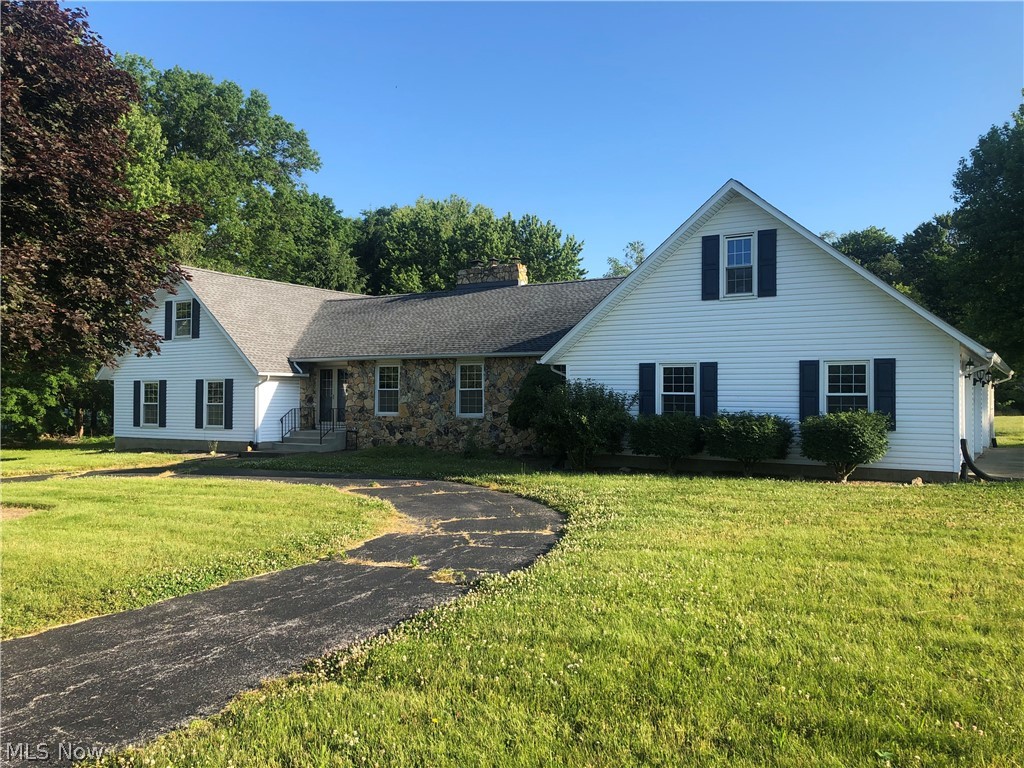 This 5 bedroom 3 & 1/2 bath home has been newly remodeled and sits back off the road for privacy. The large kitchen has an eat in area plus a formal dining room, which is attached to the formal living room for an open concept feel. The separate family room has a stone fireplace with heatilator and a sliding glass door that walks out to the back deck. There is a half bath in the laundry room mudroom area. On the main floor there 2 bedrooms and a bath plus the master bedroom that walks out to the deck with 3 closets and its own private bathroom. Upstairs there are 2 more bedrooms and another full bath. The 3 car attached garage has its own separate furnace for heat with an attic for extra storage. Enjoy the country living on 5 acres with an extra 24X36 pole barn that is cemented and has electric. All of this comes with free gas!