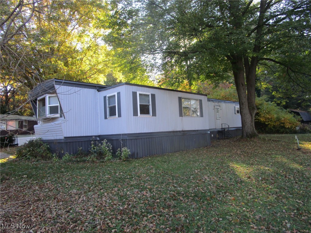 BIG price drop!Call your Agent !! Super clean, well maintained and move in ready! Don't miss this 2 bedroom mobile with an adorable kitchen, breezy sunporch, BIG living room and nice dining area - all on one floor - all on a quiet shady lot.  The sellers have installed all new floor coverings in October of 2025, added a new 60 amp electric breaker panel and are including the kitchen appliances. Extra storage is provided by the handy linen closet, pantry in the kitchen and built ins in the smaller bedroom.  Taxes are unbelievably low, at 39.00 per year, and the 8 x 8 shed is included. Parkwood Village offers a clean, well kept park with a peaceful rural vibe. Wind through the curving streets, past the tranquil pond with its floating geese and enjoy the mature trees scattered throughout. This spot is just minutes from Route 11, Route 84, shopping, fine dining, Lake Erie, historic Bridge Street, medical facilities, parks, beaches, wineries and more. Management must approve all buyers in this established 35+ years park. Ask your Agent for the forms, rules, regs, etc that are provided in the supplements section. Current rent is 259.00 per month. See the supplements for charges for pets, and discounts for seniors, in the supplements section.There are a few pet restrictions.  Residents pay their own water, sewer, heat, electric and trash. Residences must be owner occupied; no renting, leasing or sub-leasing is permitted.This is a 1973 Schult, Model 60, Title # 0401512134, Serial # 124728. If you don't have cash and need a loan, the Listing Agent can provide contact info for a few potential mobile home lenders - have your Agent reach out!. Motivated seller!
