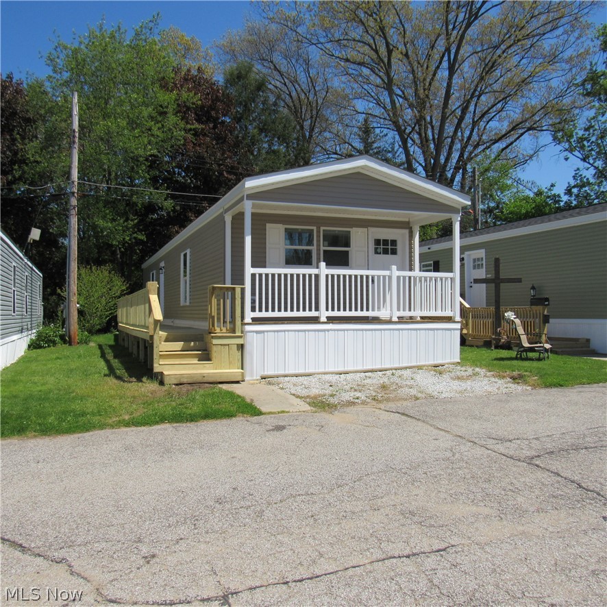 New home is located in the Heart of Portage Lakes, near many restaurants, grocery stores and abundance of activities. Home is very efficient reference to heating and cooling keeping utilities very low, two full baths one with tub and other with walk in shower
 just adjacent to the master bedroom. One floor living takes out the stress of steps and saves the knees. Kitchen delivers Brand new appliances ample cabinet space, just waiting for your cooking skills. LED lighting throughout home, same floor laundry stops the hauling clothes up and down steps. Consider, stop mowing the Grass and cleaning out the gutters, fishing is much more fun!
    Relax with a peace of Mind knowing you are the first owner and ready to call this Home. 
          Park is positioned in Highly sought after Green school district