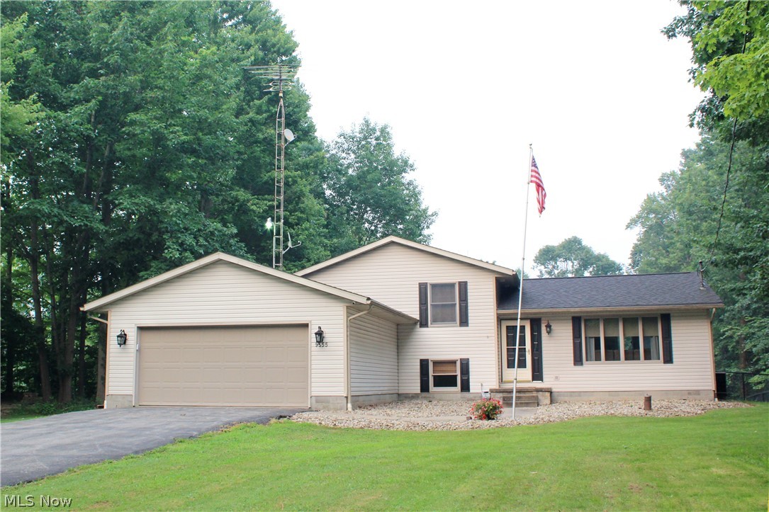 BEAUTIFUL!!  Situated on OVER 5 ACRES with a PRIVATE SETTING!! You will enjoy this FANTASTIC HOME that has been VERY WELL MAINTAINED!!  Featuring Living Room with cathedral ceiling, Kitchen with breakfast bar & all appliances, Dining Room with sliding glass doors leading to 13x21 Deck, Family Room with fireplace & newer carpeting, Master Bedroom with walk in closet, Master Bathroom with granite counter & shower, Two Additional Bedrooms with large closets, Second Bathroom with bathtub, Bonus Room, Half Bathroom, Laundry Room with washer & dryer, Basement that could be potential Rec Room area, Attached Two Car Garage and Shed for extra storage.  The back yard has a WONDERFUL SWIMMING POOL with CUSTOM BUILT DECK 24x16 and CHAIN LINK FENCE (2025).  Newer items include:  roof shingles & skylight (2023), gutter guards (2023), water softener & pressure tank (2025), sump pump (2022), swimming pool liner (2022) and garage door opener (2023).  DON'T MISS OUT on this GREAT PROPERTY!!  Call today for your PRIVATE SHOWING!!