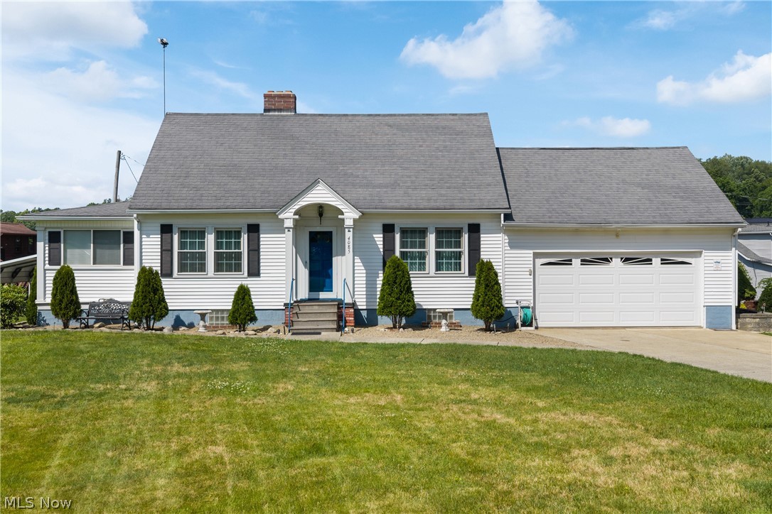Unbelievably well-maintained Cape Cod in the heart of Portage Lakes with lake privileges to the Main Chain (no dock). A true collector's dream, this property offers an attached two-car garage off Melton, an additional attached one-car garage off Alp Court, plus a large carport perfect for boats, trailers, recreational vehicles, or extra parking. This charming home features three bedrooms and two full remodeled bathrooms, including a convenient first-floor primary bedroom. Beautiful hardwood floors flow throughout much of the home. The inviting living room showcases a stone wood-burning fireplace, while the formal dining room provides the perfect space for entertaining. The eat-in kitchen offers plenty of room for everyday dining. Sunroom off living room includes large relaxing hot tub which shall convey to the lucky new owners. The walk-out lower level is accessible from the garage and features a finished recreation room with laminate flooring and a second wood-burning fireplace with tile surround. Major updates include mostly newer vinyl double-pane windows, a three dimensional shingle roof (2013), high-efficiency furnace and central air (2013), hot water tank (2019), and an upgraded 200-amp electrical panel. Offering over 1,600 square feet of beautifully finished living space, this exceptional home combines timeless character with outstanding maintenance. Ample parking and lake privileges make it the perfect place to enjoy the Portage Lakes lifestyle!