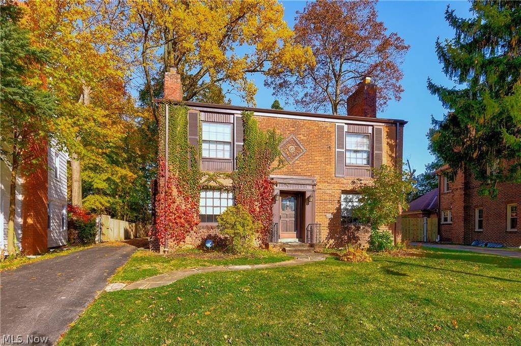 Van Sweringen built, brick center-hall colonial on large deep lot in sought after Sussex neighborhood of Shaker Heights! The spacious light filledl living room features a wood burning fireplace, built in book shelves, and french doors leading to the three season room overlooking the large fully fenced in backyard. Updated eat-in kitchen with custom cabinets, Brazilian Granite counter-tops, glass tile backsplash, & stainless steel appliances. 1st Floor half bath with a vessel sink and granite vanity top. The 2nd level includes an updated main hall bathroom with marble walk-in rainfall shower & double vanities, four well sized bedrooms, and an additional full bathroom shared between two of the bedrooms. The partially finished basement includes a marble surround wood burning fireplace, full-size windows, recessed lighting, and newer carpeting. Newer HVAC. Beautifully refinished hardwood floors and fresh paint throughout. Two car garage with opener. Close to Shaker Family Center and Van Ak