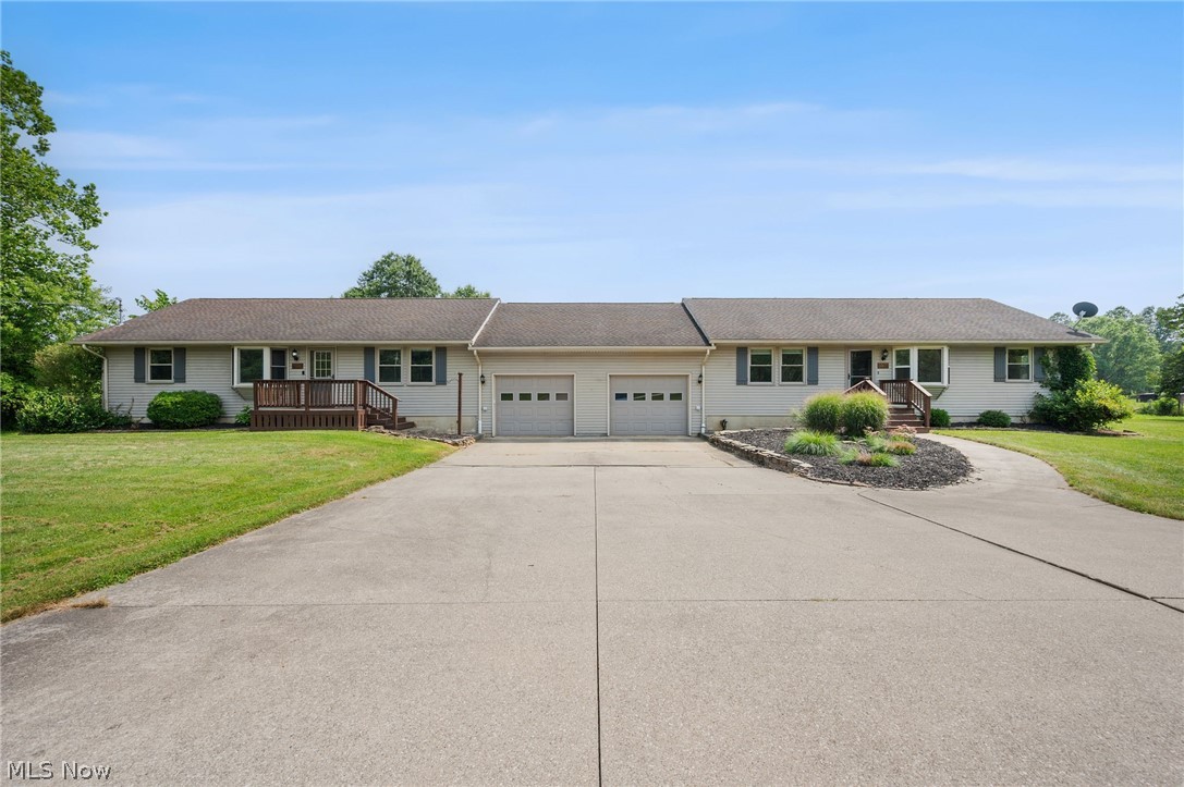 Custom-built side-by-side Ranch located on over 7.18 acres in Paris Twp, offering room to expand, add outbuildings, or enjoy a hobby or horse farm, recreation, or hunting. With exceptional flexibility for multi-generational living, extended family, guests, or supplemental rental income, this unique property features 2 complete living spaces totaling 6 bedrooms, 4 full baths & 3,372 sq ft. Each living space offers 3 bedrooms, 2 full baths, attached 1-car garage, private front entrance, 1st-floor laundry, full basement accessed thru the garage & access to a shared enclosed porch leading to the backyard. The property also features a 30' x 50' outbuilding w/ concrete floor & electric, plus a storage shed, providing space for hobbies, equipment, or additional storage. One living space has been fully updated w/ LVP flooring, an updated eat-in kitchen featuring stainless steel appliances, granite countertops, tile backsplash & peninsula breakfast bar. The kitchen opens to a flexible living/dining area, while a spacious family room provides access to an enclosed porch and deck. The primary bedroom features a walk-in closet and updated en-suite bath w/ shiplap walls and a walk-in shower. The 2nd living space offers the same spacious layout w/ an eat-in kitchen featuring stainless steel appliances, abundant cabinetry & a peninsula breakfast bar. The open living/dining area flows into a spacious family room w/ LVP flooring, wood-burning stove & access to an enclosed porch leading to the backyard. The primary suite includes a walk-in closet and en-suite bath w/ a tub/shower combination. Whether accommodating multiple generations under one roof, creating private space for extended family or guests, or utilizing 1 living space for supplemental rental income, this versatile property offers exceptional flexibility. Sellers also own the adjacent 7.46-acre vacant parcel and would consider selling, creating the opportunity for nearly 15 contiguous acres.