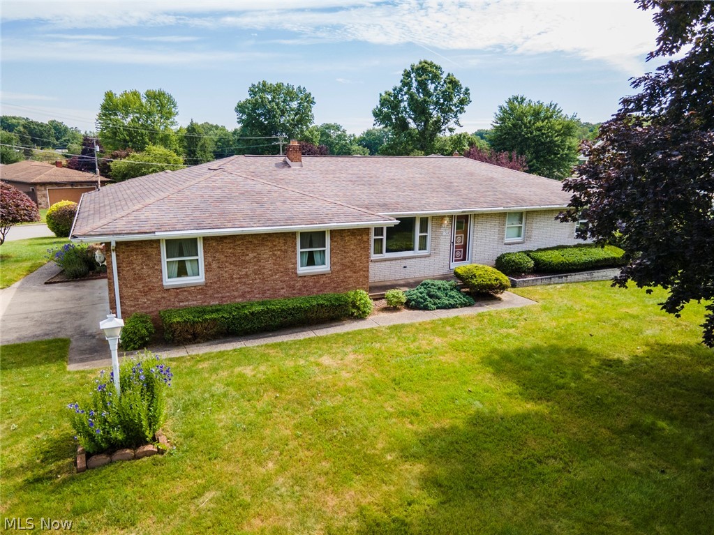 Welcome to your dream home! Nestled on a desirable corner lot in a sought-after neighborhood, this fully updated brick ranch is a must-see. As you walk through the front door, you'll be greeted by a warm and inviting family room, featuring a chic, modern grid accent wall that seamlessly flows into the stylish eat-in kitchen. The kitchen boasts brand-new cupboard doors, quartz countertops, and a sleek backsplash. Plus, the built-in sidebar offers extra storage and counter space, perfect for all your culinary needs.
Adjacent to the kitchen, the oversized dining room offers sliding door access to a covered patio, creating an ideal setup for entertaining. Down the hall, you'll find a spacious bathroom adorned with custom wainscoting and a luxurious double-vanity. Three generously sized bedrooms and primary half bathroom complete the first floor. Luxury vinyl plank flooring ensures easy cleaning and a consistent, modern look throughout the home. The finished basement offers a versatile space that can be transformed into a movie room, game room, playroom, or even a bar—the possibilities are endless in this cozy retreat! Outside, you can relax and enjoy the beautifully landscaped yard from either the front porch or the covered back patio. With thoughtful design and quality workmanship evident in every detail, all that's left for you to do is pack your bags and move right in! Open House Saturday 6/29 2-3:30PM.