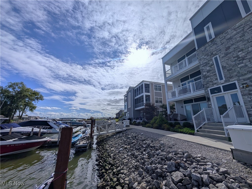 PRICE UPDATE! Offered fully furnished with lake-life décor, the condo is truly move-in ready so you can start enjoying the season as soon at it's here! Your 3 Bed/2 Bath/2 Balcony + Rooftop Deck Waterfront Condo offers sun-filled living at the one of a kind bayfront development, Marblehead Estates & Yacht Club.

Inside your home - the waterside balcony off the main living area showcases peaceful views of the naturally landscaped marina and shimmering sunrays across the bay — the perfect backdrop for morning coffee or evening relaxation looking into the sunset. The primary suite features its own private balcony, plus an additional custom window that expands your bay views and fills the space with even more blue skies and natural light.

This condo home sits in a prime location within the community. You're just a few steps to the amenities like the shimmering heated pool sitting atop the private bayfront beach, a 360 degree waterfront gazebo, grill patio, clubhouse and more!

BONUS: You have the option to secure a 40' shoreline dock slip and/or a 40' garage unit (both currently sold out) with your condo home purchase. The choice is yours!

The lifestyle of comfort, convenience, and one-of-a-kind waterfront living is yours! Come see for yourself!