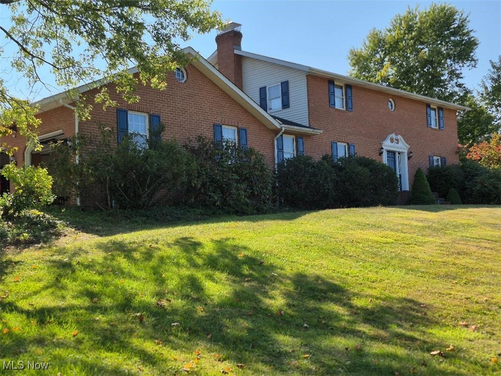 This serene Amish built, all brick 2-story is located on 1.96 acres with a pool and a private fenced in back yard. This beautiful home has 3 bedrooms upstairs with a fourth bedroom/office on the first floor. The kitchen comes with all appliances, oak raised panel cabinet doors, and pull out shelves in base cabinets, a 3 x 5 center island, pantry and a desk area with under cabinet lighting. Two appliance garages are included. Crown mold is included with a dinette area with windows looking outwards to the pool. The formal dinning room has crown mold and is right off the kitchen. The foyer is oak parquet flooring with an oak stairway leading to the 2 floor. The great room is L-shaped with crown mold and a fire box (the box is not connected to the chimney). First floor laundry room with washer and dryer, coat closet and a full bathroom with a 3-0 shower, close to the garage. The 2'a floor has a main bathroom and master bathroom. 2 bedrooms with his/hers closets and crown mold. The master bedroom is huge with crown mold and a L-shaped walk-in closet. The front side of the basement is finished (644 sq ft est.) with a full bathroom. Room for parties or a pool table, crown mold, can lights and a fire box that works. The utility room on the back side has easy access to the garage and contains the electrical box, furnace, water heater and soft water system. Two unfinished rooms can be used as a workshop. A vacuflo system with hoses and a security system is included. The 4 car (48 x 30) garage pole building with 4 garage doors (1997) and a (36 x 18) heated pool was install in (1986). A gas grill and electric hot tub is located on a brick patio. The existing underground gas line will be disconnected to the house and the Buyer shall need to convert to either geothermal, electric or propane. All mineral rights. Swimming pool has a deep end. Seller will make concessions on having the furnace and water heater change to electric or propane.