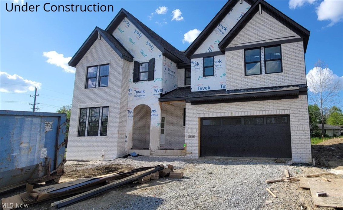 Introducing the award-winning Hollister plan, thoughtfully designed w/ the primary bedroom on the main level & enhanced throughout w/ high-end finishes. Positioned on a spacious corner lot, this new-construction home offers modern elegance, comfortable living, & exceptional craftsmanship. The stunning exterior features a timeless blend of light brick, stone accents, & James Hardie siding.  Architectural gables, dark trim, & a covered front entry elevate the curb appeal, while the carriage-style garage door & upgraded exterior lighting complete the upscale look. Bright main level w/ 9’ ceilings, wide-plank hard-surface flooring, & an inviting electric linear fireplace w/ full-height stone surround. The gourmet kitchen features Cashmere Taj quartz countertops, Aristokraft Benton Birch cabinetry, a premium Whirlpool gas appliance suite, a custom wood hood, a large island w/ upgraded detailing, & a striking vertical subway tile backsplash. The main level also includes a dedicated home office, welcoming foyer, laundry, & an upgraded sliding glass door that seamlessly connects to the outdoor living space. The first-floor primary suite offers a peaceful retreat w/ soft carpeting & a spa-inspired bath showcasing Carrara Breve quartz, a frameless matte-black shower enclosure, Calacatta Sky tile, & dual sinks w/ matte black Moen fixtures. Upstairs is a spacious game room / loft area complemented by secondary bedrooms & baths featuring quartz counters, upgraded plumbing fixtures, & thoughtfully selected hardware and finishes. The partially finished basement offers a spacious rec room & a convenient half bath—ideal for entertainment, guests, fitness, or hobbies. Additional functional features include a tankless water heater, sump pump with battery backup, Z-Wave smart thermostat & 200-amp electrical service. This Hollister home blends thoughtful architecture, premium finishes, & comfortable everyday living. Estimated Completion, July 2026.