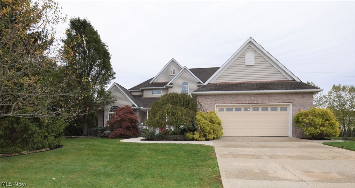 This impressive, custom-built Kemppel home in Stow has 4 bedrooms and 3 bathrooms. The living room has dramatic two-story high ceilings with gorgeous windows overlooking the backyard. The eat-in kitchen has an abundance of counter and cabinet space, stainless steel appliances, and an island. Sliding glass doors in the kitchen lead to the backyard patio. The Master Suite has gorgeous Cathedral ceilings, lots of windows, and recessed lighting. Three-car tandem 
garage. Don’t let this incredible home get away!
