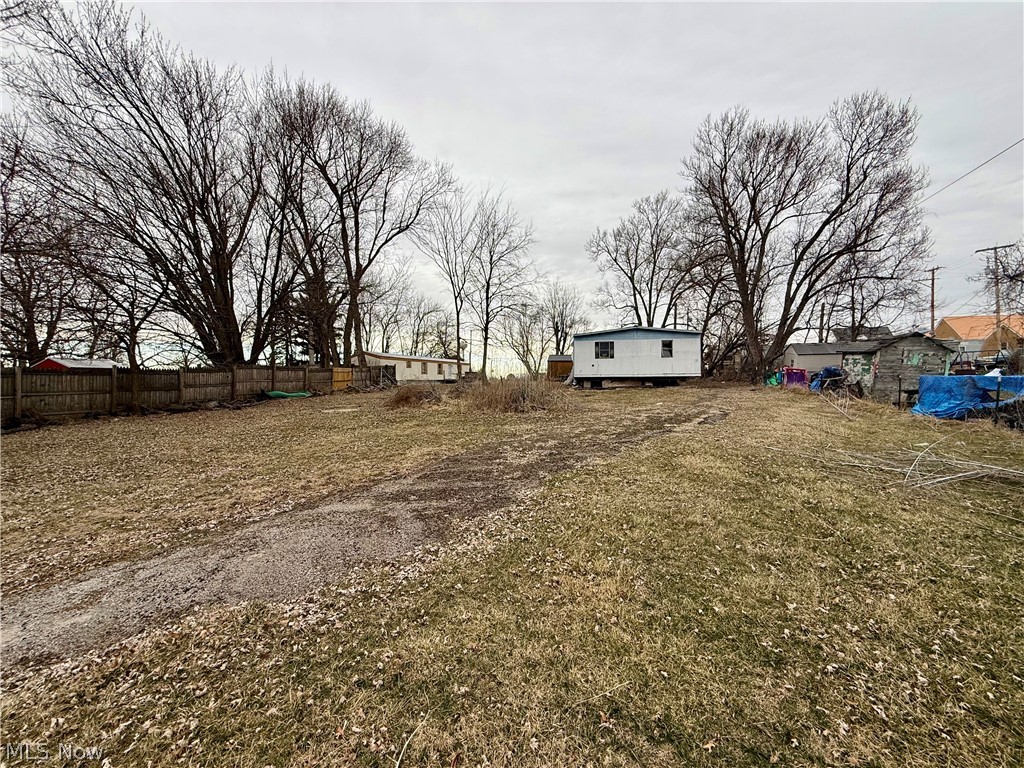 Vacant Lot in Desirable Smithfield Location. Great opportunity to own a flat, vacant lot in a well-established area of Smithfield. Public water, sewer, and electric are available, making it ready for your next project. An older mobile home is currently on the property but is not in use and conveys as-is. Bring your ideas and make the most of this versatile property in a convenient location!