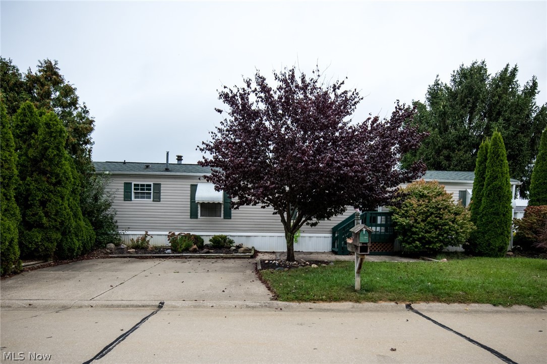 Welcome to this 2 bedroom, 2 full bathroom manufactured home in the Golfway Pines Community. This home features a comfortably sized living room and eat-in kitchen with a separate laundry room. The master bedroom is generously sized and has an attached master bathroom with bathtub and double vanities. You'll find an additional bedroom and full bathroom off the hallway that boasts ample storage. The deck outside is large enough for you to enjoy with family and friends. All appliances remain with the home. Guest parking is conveniently located immediately to the left of this home. You will also have access to the Golfway Pines Community Room for your next family party. Come and see what this home has to offer!
