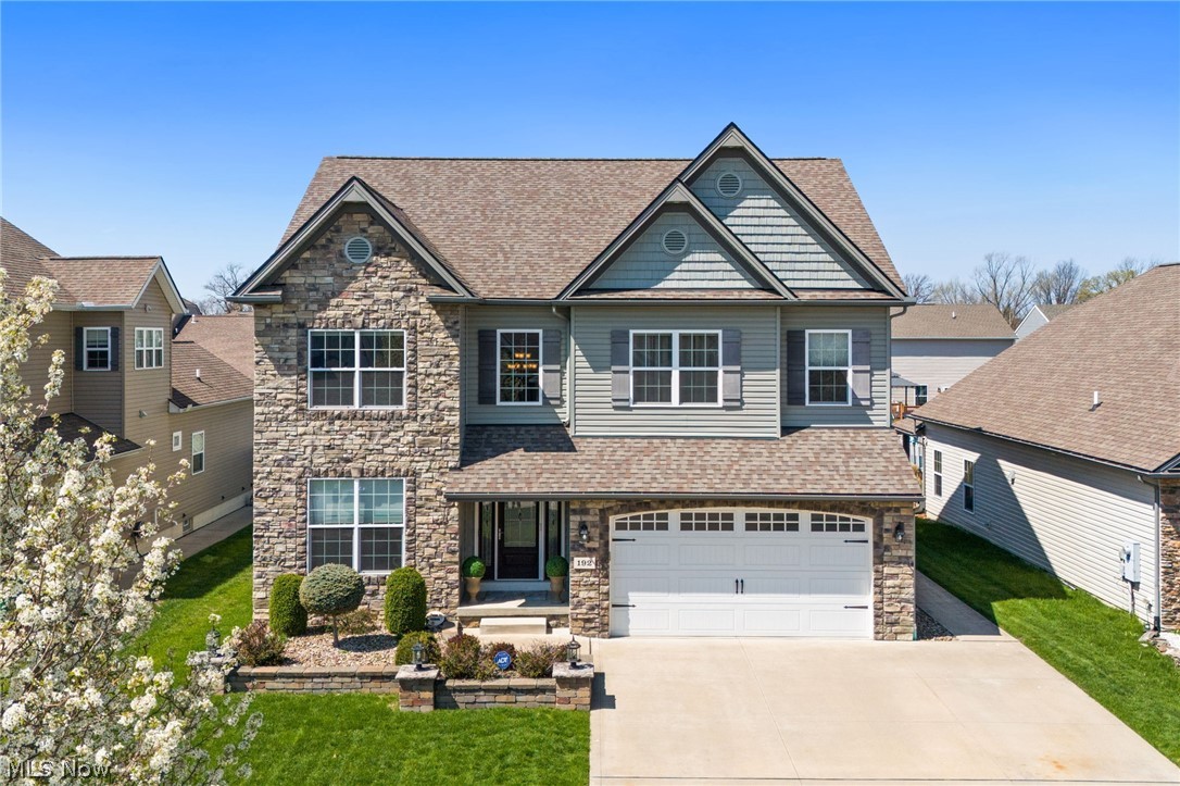 Welcome to this beautifully maintained Knez built colonial in Shoreland Crossings offering over 4,000 square feet of finished living space, including a beautifully finished lower level and high end finishes throughout! A dramatic two story foyer creates an impressive first impression and opens to a private office, elegant dining room, and spacious main living area designed for both everyday comfort and entertaining. The kitchen features granite countertops and a stone backsplash, opening seamlessly to the great room with fireplace and flowing into a stunning four season room with a vaulted ceiling, filled with natural light and overlooking the backyard. Upstairs, the spacious owner’s suite offers a private retreat with a tiled shower and his and her walk in closets, while three additional bedrooms, a full bath, and second floor laundry provide convenience and functionality. Granite countertops in the bathrooms and basement continue the home’s polished feel. The expansive finished basement adds even more living space with a full second kitchen, dual bar areas, media space, half bath, and plenty of room for hosting or relaxing. Outside, enjoy a beautifully finished patio and backyard that extend the home’s entertaining potential. This move in ready home offers exceptional space, style, and functionality throughout.