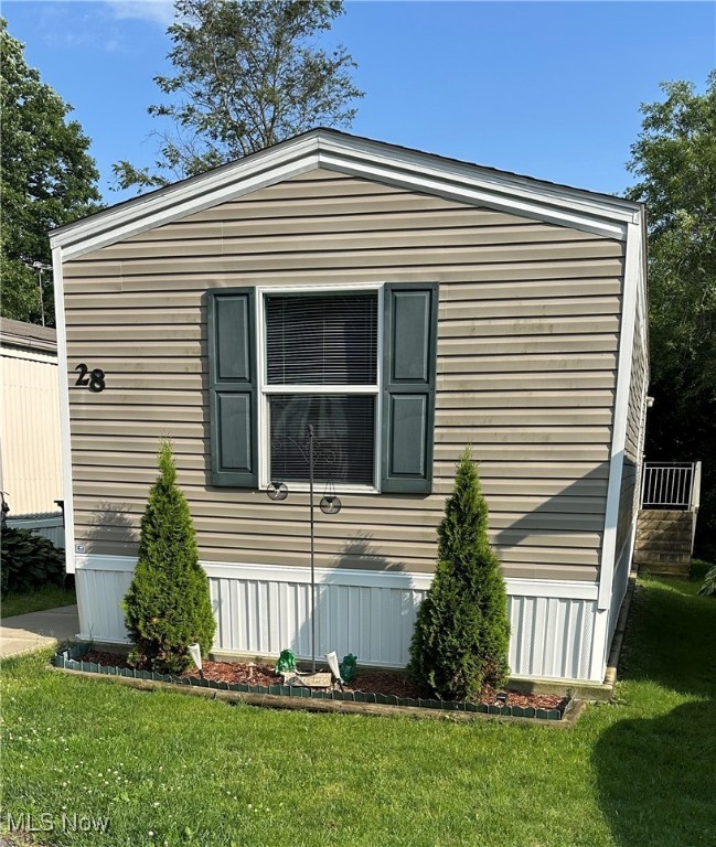 Welcome to this well-maintained mobile home with spacious layout and ample space. This home features 2 bedrooms and 2 full baths, one on each side of the home for maximum privacy. In the middle, you will find an open concept living room and kitchen with walk-in laundry room. This home has newer central air (2022) and a great deck with room for patio table and chairs for enjoying those summer days! An additional storage shed is also included in the sale! Looking for affordable housing in a comfortable setting, look no further! Call your favorite agent and schedule a showing today! Applicants must be approved through Rex Hill prior to moving in. There is a $50 application fee. Current Lot rent is $498/month